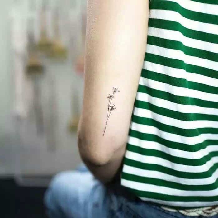 Delicate minimal flowers tattoo - Tattoogrid.net