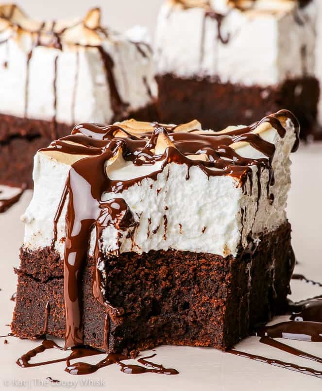 Marshmallow brownies topped with chocolate sauce.