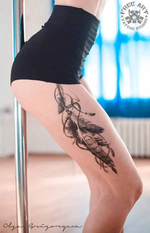 feathers thigh tattoo