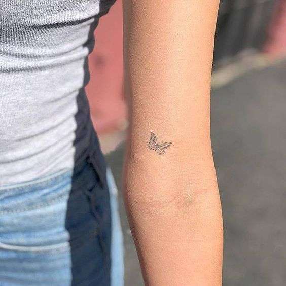 Tattoo tagged with small grey inner arm elbow black butterfly  animal tiny dino nemec little fine line insect  inkedappcom