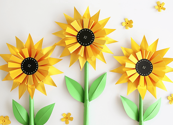 milkychoco04_Three_paper_folded_craft_sunflowers_with_green_ste_78f873f6-88a0-4b3d-98ba-7cf55ad2d8db