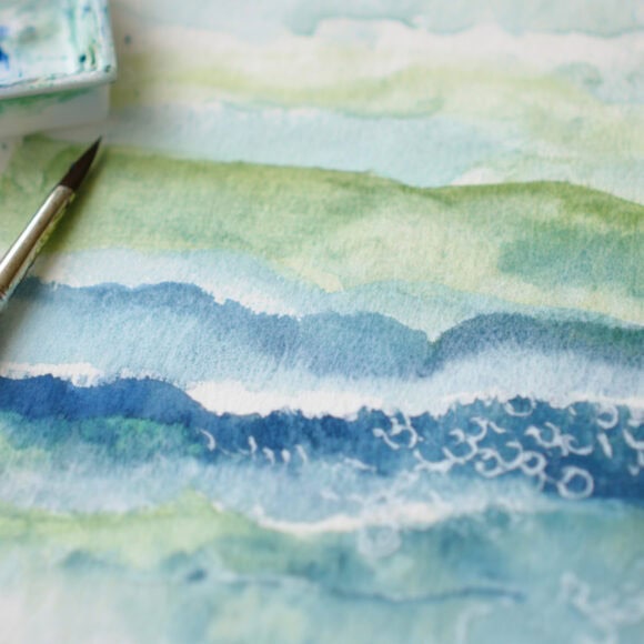 emthehuman1_a_watercolor_brush_next_to_a_painting_of_a_loose_wa_6284f253-b9a9-4aa8-9edd-ae163ef0d114