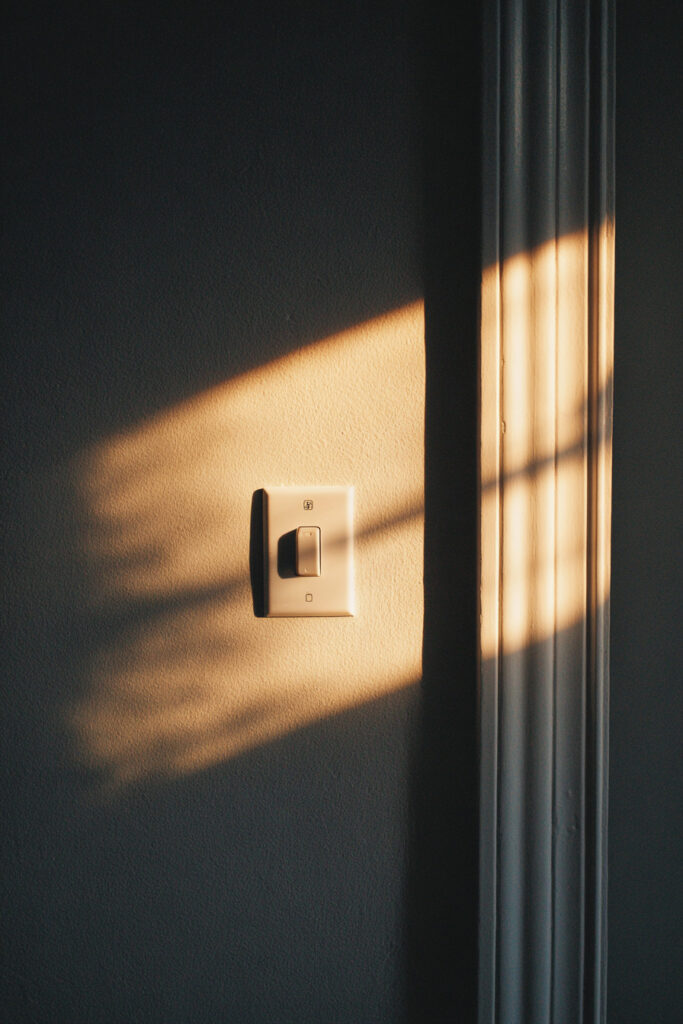 Minimal light switch detail photography concept.