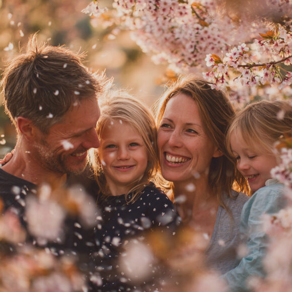 emthehuman1_candid_photograph_of_a_Smiling_family_peeking_behin_d03edc24-f652-4cf5-a884-d11bbada76de